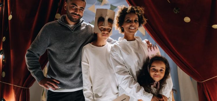 Family dressed up for a fun home theater activity, showcasing creativity and bonding.